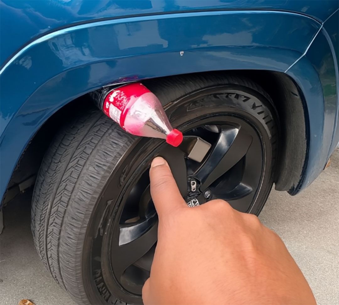If you see a bottle stuck between the wheel and the chassis of your car, do not climb into it.