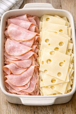 Layer ham and swiss cheese in a casserole dish and get a meal so delicious your husband will be begging for more! It tastes like a warm sandwich in a bowl.