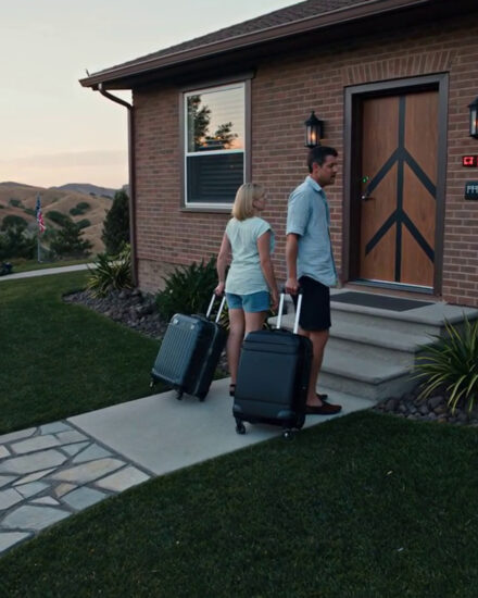 My dad never hung up. I heard, “She’s stupid enough to let us stay.” I booked their Italy trip, sold my $980,000 house, locked every door. They came home smiling. The code? Denied. The moment my heart shattered wasn’t dramatic. There was no thunder, no ominous music, just the ordinary crunch of gravel under my tires as I pulled into the driveway of my ranch house outside Austin, exhausted from a ten-hour work marathon debugging a client’s interface. Then I saw it. Or rather, I saw where it used to be. My Aunt Alice’s rose garden—two hundred square feet of antique heritage roses, bourbon roses, and climbing Cecil Brunner that had taken her thirty years to cultivate—was gone. Erased. In its place was a flattened patch of brown dirt, smooth as a putting green, with industrial rolls of artificial turf stacked at the edge like oversized carpet samples. A small bulldozer sat nearby, its bucket still caked with soil and what looked like shredded roots. I sat frozen in my car, hands still gripping the steering wheel, staring at the carnage. The garden had been right there this morning. I had passed it on my way out, noted the early blooms on the Madame Isaac Pereire. Now there was just… nothing. My vision tunneled. I couldn’t breathe. I stumbled out of the car, my laptop bag forgotten on the passenger seat, and walked toward the destruction on legs that didn’t feel attached to my body. The air smelled wrong—like diesel and torn earth instead of the faint rose perfume that usually drifted through the yard on spring evenings. “Oh, you’re home early.” My father’s voice cut through my shock like a hacksaw. “What do you think? Pretty impressive, right?” Arthur Bennett stood near the artificial turf rolls, hands on his hips in that self-satisfied pose he always struck when he thought he’d done something clever. At sixty-two, he still had the build of a former high school football player gone soft—broad shoulders, thick around the middle, with silver hair he kept meticulously groomed. He was wearing khakis and a polo shirt, like he was about to tee off at a country club instead of standing in the ruins of something irreplaceable. “What?” My voice came out strangled. “What did you do?” “Upgraded the property.” He gestured grandly at the dirt. “Those thorny bushes were a liability, Skyler, lowered the property value. Do you know how many times I’ve gotten scratched just walking past them? A putting green, though—now that is class. That is the kind of feature that says successful people live here.” My mother, Kate, emerged from the house carrying two glasses of iced tea. She was sixty but dressed like she was trying to recapture forty—blonde highlights, too much jewelry, a tunic top that probably cost more than my monthly grocery budget. She had been pretty once, I think, before bitterness had settled into the lines around her mouth. “Skyler, don’t just stand there gaping,” she said, handing one glass to my father. “You could at least thank your father for improving your property. The neighbors are going to be so jealous.” “Thank him?” I could barely form words. “You… you destroyed Aunt Alice’s garden. That garden was—” “A bunch of weeds that attracted bees and took up valuable space,” Dad interrupted, taking a long drink of his tea. “Your aunt had no sense of modern landscaping. This is a ranch property, Skyler. It should look refined, not like some overgrown cottage in the countryside.” “Those roses were heritage plants.” My hands were shaking. “Some of them were over fifty years old. Aunt Alice—” “—is dead,” Mom said flatly. “And she left you the house, not her garden hobby. Frankly, I think she would be pleased to see the property being managed by people with actual taste.” The workers were already unrolling the turf. One of them glanced at me, saw my face, and quickly looked away. They’d been paid to do a job. They didn’t care that they had just bulldozed my last tangible connection to the only family member who had ever actually loved me. “You had no right.” My voice cracked. “This is my house. You had no right to—” “No right?” Dad’s face darkened. He took a step toward me, and I instinctively took a step back. “I am your father. I’ve been living under this roof for two years, paying my dues, putting up with your rules and your attitude. I have every right to make improvements that benefit the household. Or did you forget that you invited us to live here?” That was the spin, wasn’t it? I had invited them. The truth was messier, and it sat in my stomach like a stone. Two years ago, my parents had declared bankruptcy. Dad’s “investment opportunities,” which I had learned meant gambling on penny stocks and lending money to his equally broke friends, had finally caught up with them. They’d lost their house in the foreclosure. Mom had called me crying, saying they were going to be homeless, that Dad’s knee was too bad for him to work anymore, that they just needed somewhere to stay for… maybe three months. Tops. While they “figured things out.” And I, like an idiot, had said yes. Aunt Alice had died eight months before that, leaving me her custom brick ranch house on three acres of Texas hill country. The property was worth over a million dollars, a ridiculous windfall for a twenty-eight-year-old UX designer who had been living in a cramped apartment in downtown Austin. The property taxes alone were $25,000 a year, but I had been managing. Remote work paid well, and I had been careful. When my parents asked to stay temporarily, I convinced myself it was the right thing to do—filial duty, family obligation, all those things that had been drilled into me since childhood. Three months became six. Six became a year. Now it was two years, and they had completely taken over. They had moved into the master wing—the entire east side of the house, with its spa bathroom and private patio—claiming Dad’s bad knee meant he couldn’t handle stairs. Never mind that my home office was upstairs and I had to climb those stairs a dozen times a day. Never mind that I’d watched Dad take those same stairs just fine when he wanted to raid the storage closet for my aunt’s vintage bourbon. They contributed exactly zero dollars to household expenses. No groceries, no utilities, no property tax. When I’d tried to bring it up delicately, Mom had cried and said I was punishing them for being poor, and Dad had gone silent and cold for three days until I apologized. They treated the house like it was theirs. They threw parties. They rearranged furniture. They criticized my decorating choices, my cooking, the friends I invited over. And I had let them. Because I was weak. Because I didn’t know how to say no. Because some broken part of me still believed that if I was just good enough, patient enough, generous enough, they might finally act like parents, instead of parasites. But this—this was different. The rose garden wasn’t just plants. It was Aunt Alice’s legacy. It was the place I had spent summers as a kid, helping her prune and mulch, listening to her stories about each variety: the Madame Hardy she’d gotten from a nursery in France, the Reine de Violette that had survived the freeze of ’89, the climbing Don Juan that covered the arbor where she’d scattered my uncle’s ashes. It was the only place on the property that still felt like hers, like mine, and they had bulldozed it to install a freaking golf course. “I want it put back,” I said, and my voice came out harder than I had ever heard it. “I want you to call these workers off, return the turf, and figure out how to restore what you destroyed.” Dad actually laughed. Continued on next page: