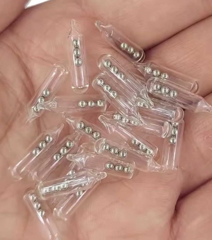 Identifying Small Glass Tubes Containing Three Tiny Ball Bearings